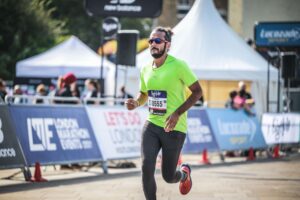 A man running in a race or marathon
