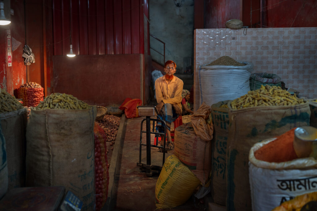 A man sells turmeric in Dhaka, Bangladesh.