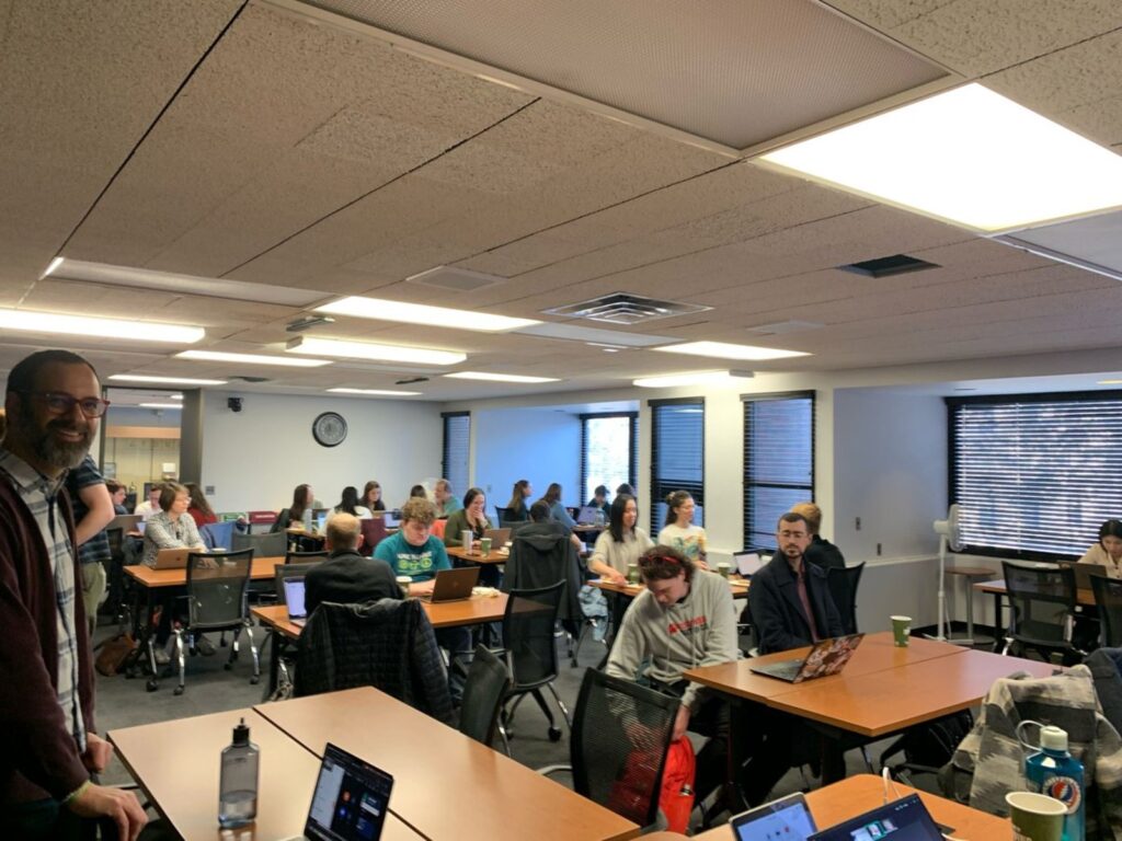 Graduate students and economists in a classroom