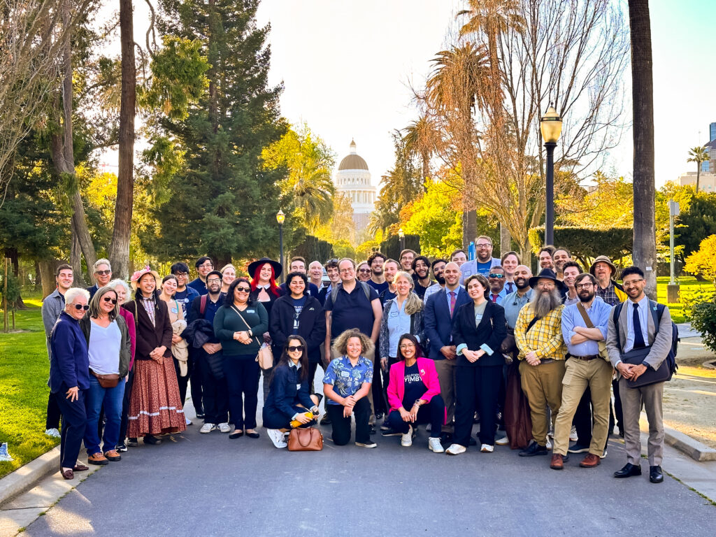 The CA YIMBY team poses in front of the California State Capitol Building.